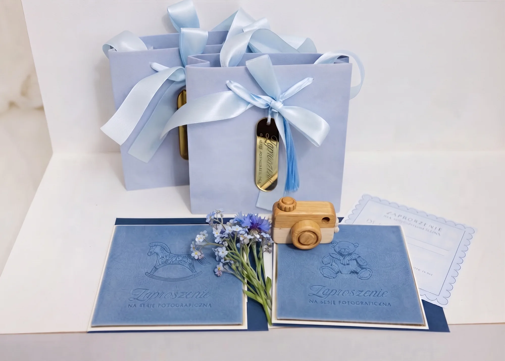 Blue gift voucher with an invitation to a photo session for a boy
