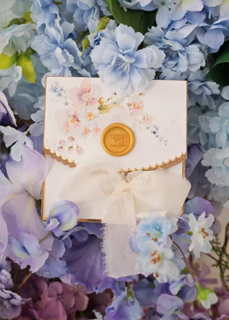 Photo session gift voucher among blue and purple flowers