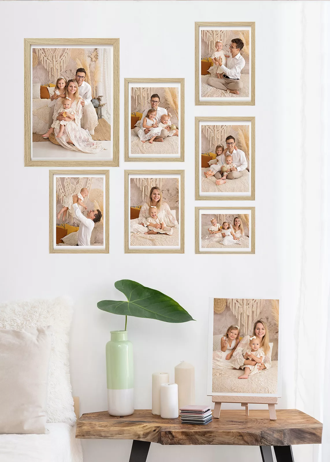 Wall of framed family session photos in a studio in Warsaw