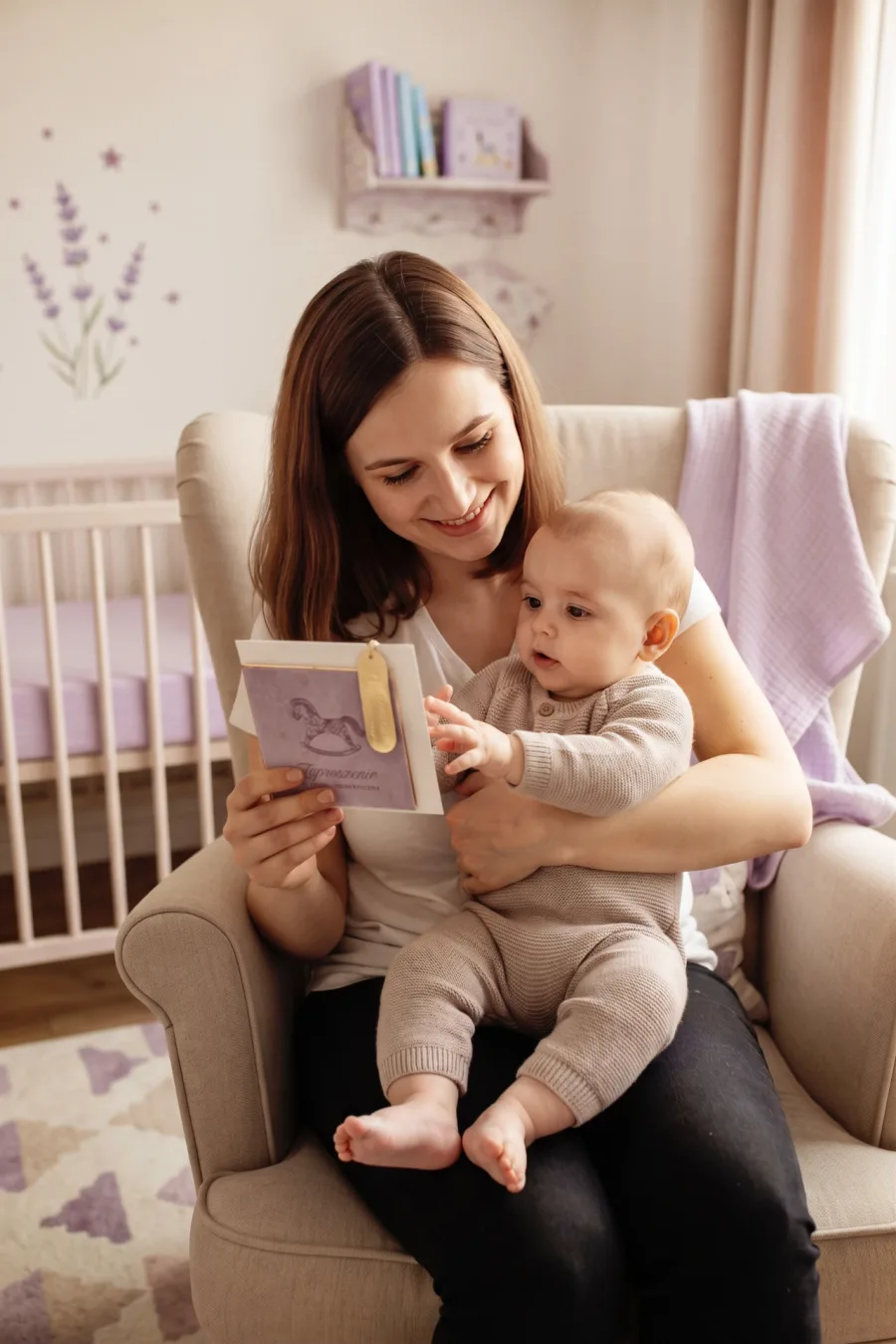 Purple gift voucher — mum showing the session gift card to her child